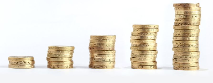 one pound coin stack arrange growong up on white background