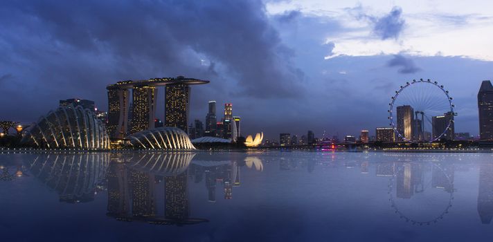 An evening shot of Singapore lighted cityscape. 