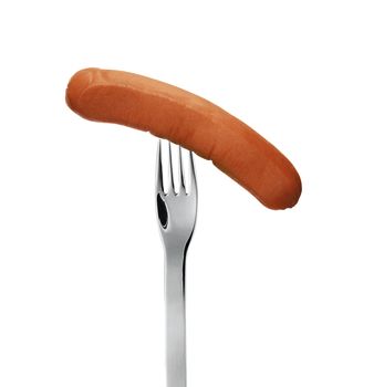 close up of sausage and fork