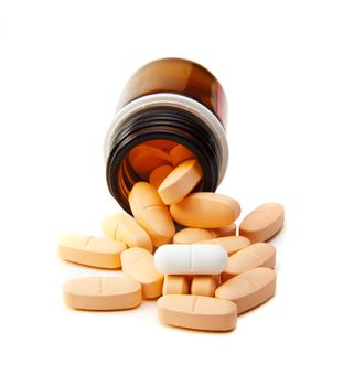 Overhead view of pills in plastic pot