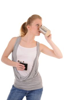 Casual blonde girl with metal cup and flack is drinking