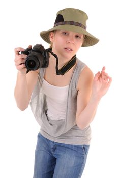 Casual girl-tourist with digital photocamera is looking for picture on white background