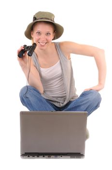 Casual woman with binocular is searching information with laptop