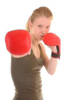 Portrait of a attac girl with red boxing gloves. Focus on nearest glove.