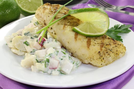 Potato salad with fresh herbs and hake fillet