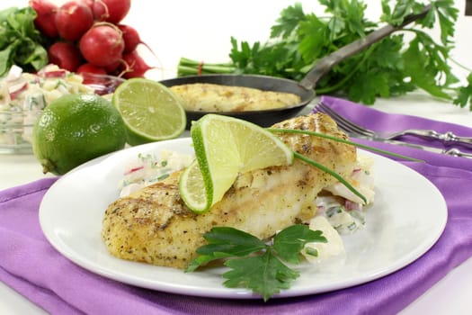 Potato salad with fresh herbs and hake fillet