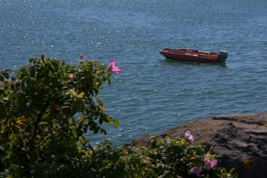 A small boat adrift in a bay