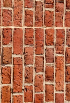 Old brick wall built of clay bricks.