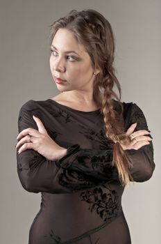 Portrait of a young and beautiful girl in a dark-colored clothing