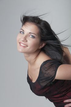 Portrait of a young and beautiful girl in a dark-colored clothing