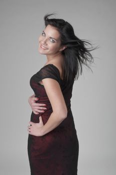 Portrait of a young and beautiful girl in a dark-colored clothing