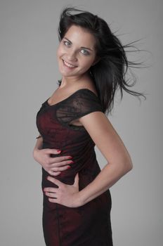 Portrait of a young and beautiful girl in a dark-colored clothing