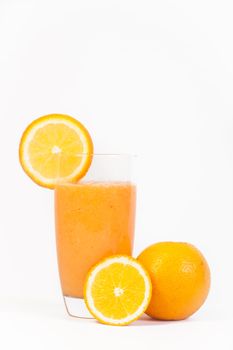 A delicious glass of natural orange juice isolated on a white background.