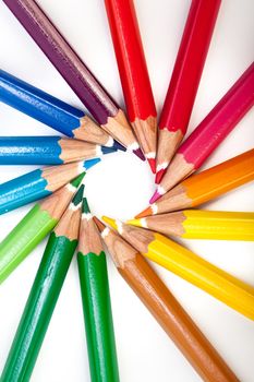 A vivid image with various colored pencils such as yellow, orange, red, pink and blue.