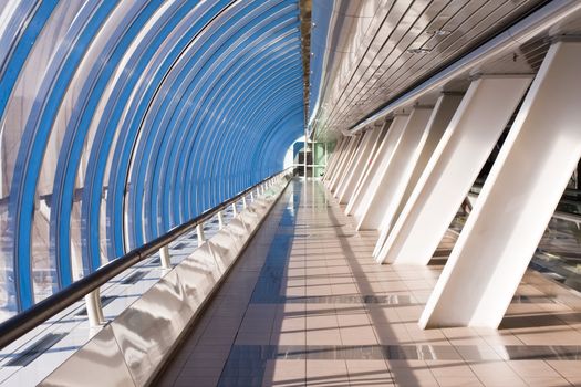Conceptual office bridge with sunny reflections