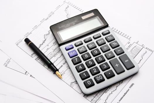 Business charts and calculator isolated on white