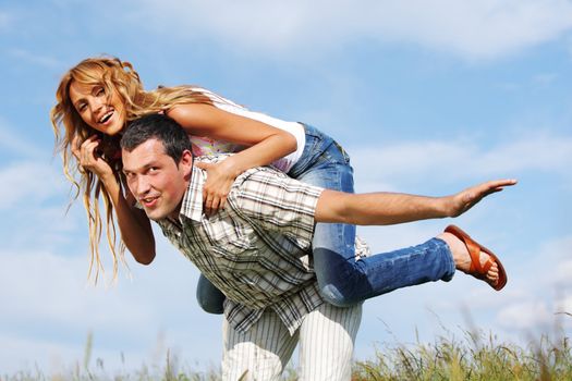 man and woman hug in the sky