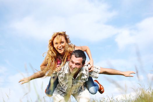 man and woman hug in the sky