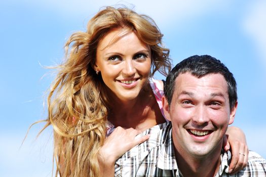 man and woman hug in the sky