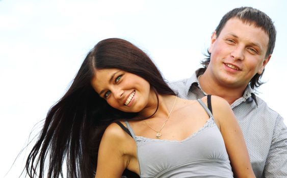 man and woman hug in the sky