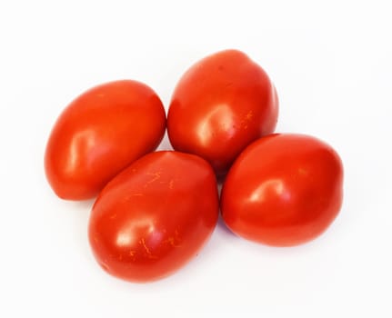 Four ripe tomatoes isolated on white background 