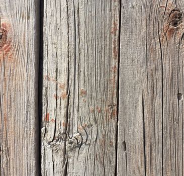 Close up of gray wooden fence panels 