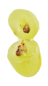 Translucent slice of green grape fruit, macro isolated on white 