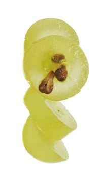 Translucent slice of green grape fruit, macro isolated on white 