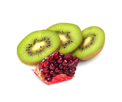 kiwi with pomegranate grain on white 