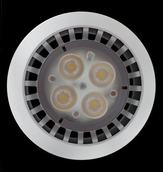 LED Light bulb illuminated and taken from above and isolated against black