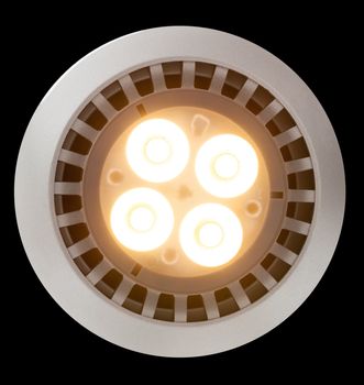 LED Light bulb illuminated and taken from above and isolated against black