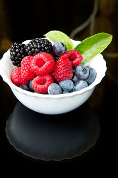 Big Pile of Fresh Berries on black background