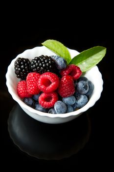 Big Pile of Fresh Berries on black background