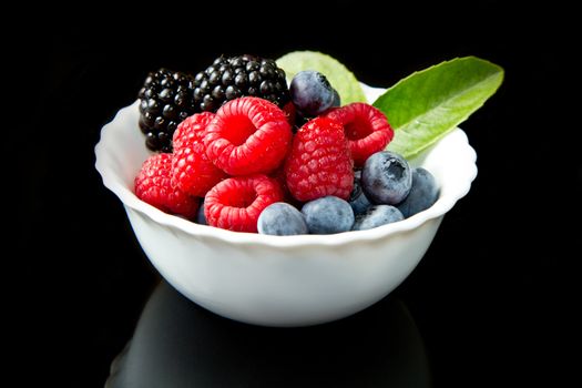 Big Pile of Fresh Berries on black background