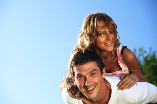 man and woman hug in the sky