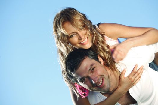 man and woman hug in the sky