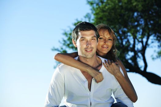 man and woman hug in the sky