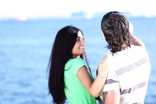 man and woman hug in the sky sea on background