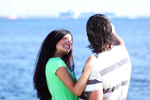 man and woman hug in the sky sea on background