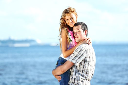 man and woman hug in the sky and sea on sea