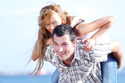 man and woman hug in the sky and sea on sea