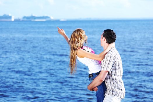 man and woman hug in the sky and sea on sea