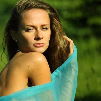 woman on the green grass happy and smile