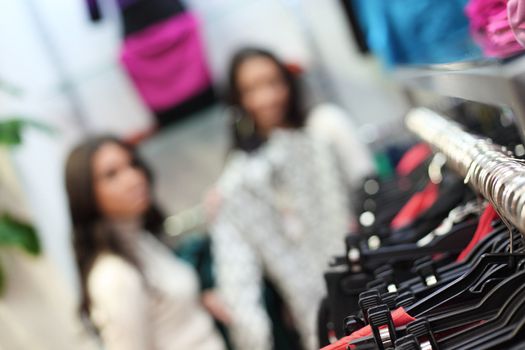 woman in shop look at clothes