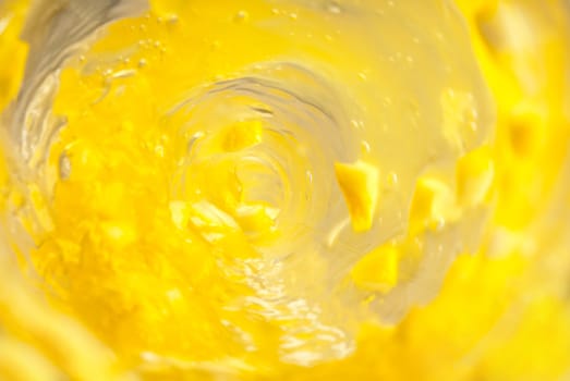 Inside bottle shot while pouring yellow juice