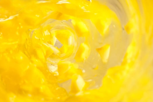 Lemon chunks drenched in a yellow whirlpool