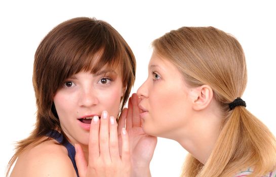 One young woman tell surprise news to another girl on white background