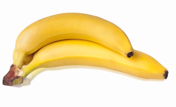 Bunch of fresh bananas with soft reflection isolated on white background. Shallow depth of field.