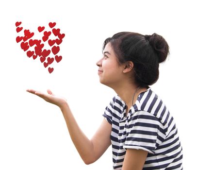 Romantic young woman holding a many red heart in hands