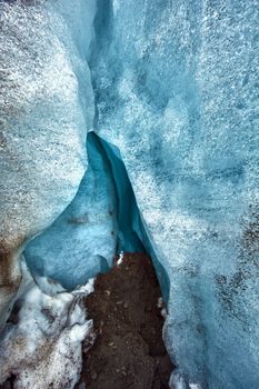Detailed photo of the Icelandic glacier ice cave with a incredibly vivid colors and a nice texture